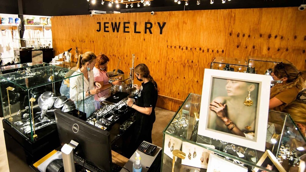 A jewelry store with wooden walls and glass display cases. 5