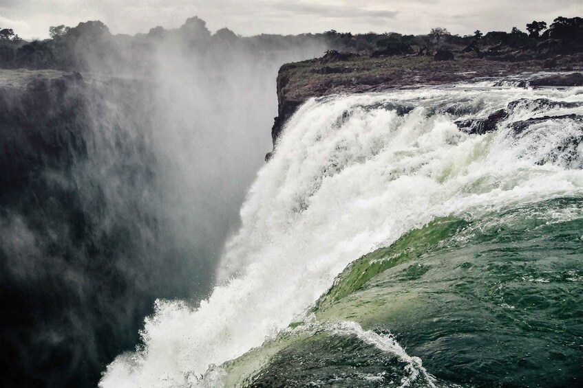 A powerful waterfall cascading over a rocky cliff. 3