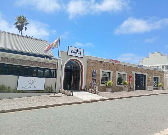 A street with a building labeled 'Cafe Gannet' and 'Seafood House.' 5
