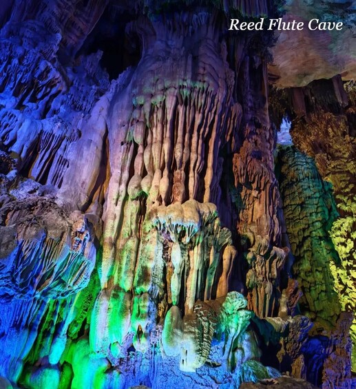 A cave with colorful stalactites and stalagmites. 1