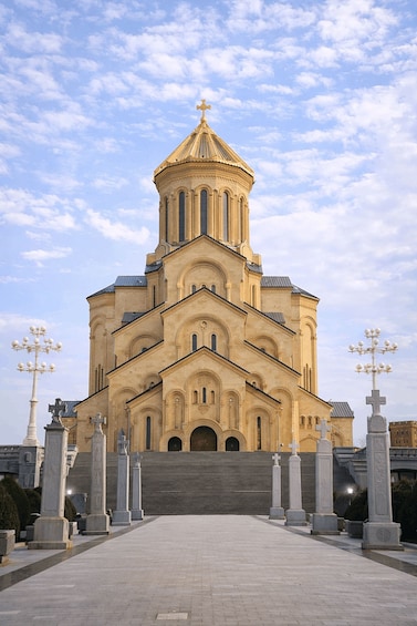 A large, ornate church with a prominent dome and multiple crosses. 3