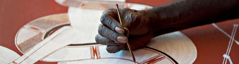 A hand drawing on a patterned surface. 3
