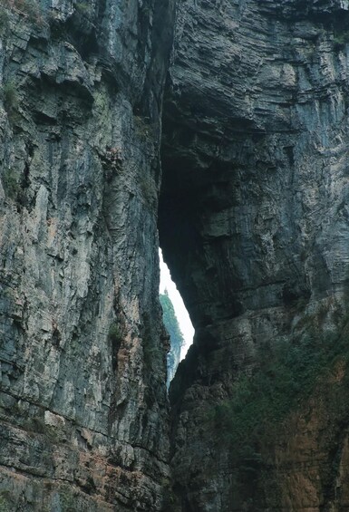 A rock formation with a natural archway. 4