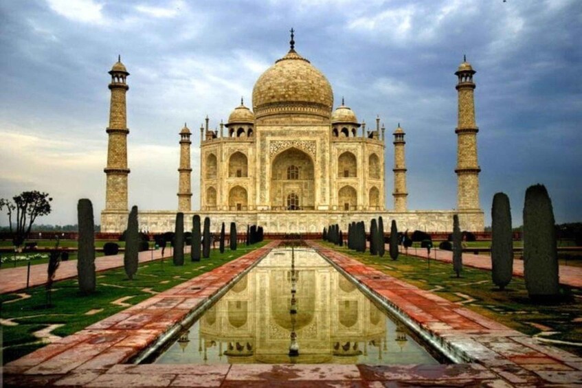The Taj Mahal with its reflection in the water, four minarets, and a central dome. 3