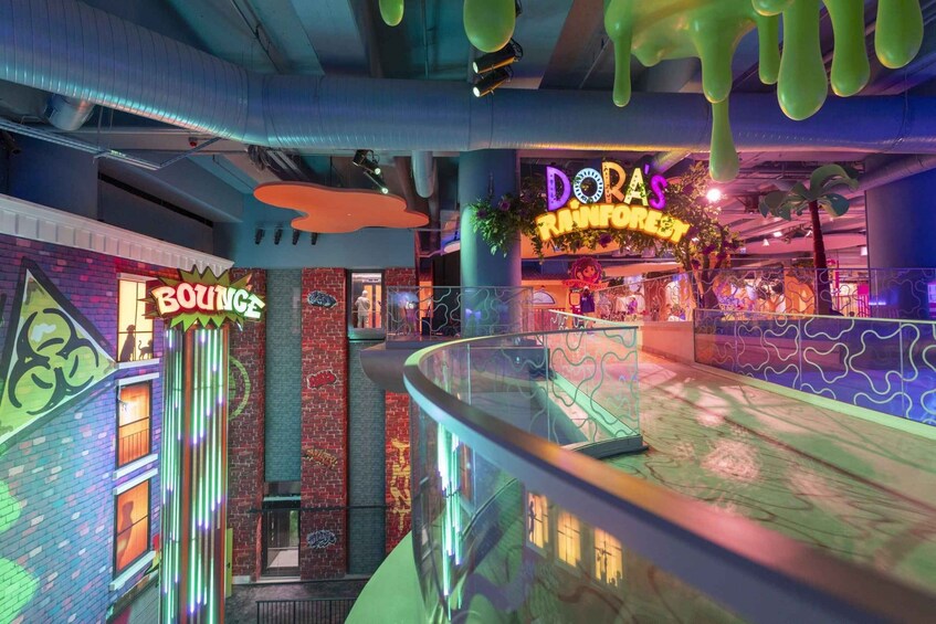 An indoor space with a neon sign for 'DORA'S RAINFORGET' and a 'BOUNCE' sign. 4