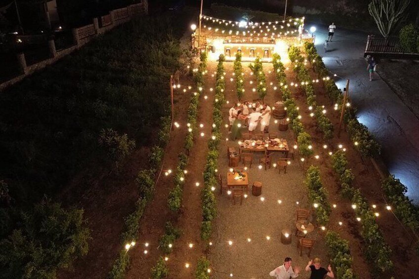 An outdoor dining area with string lights and tables. 4