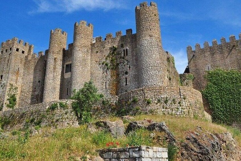 A medieval castle with multiple towers and battlements. 2
