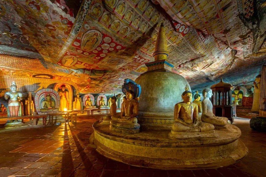A temple interior with ornate ceilings, golden Buddha statues, and intricate wall carvings. 2