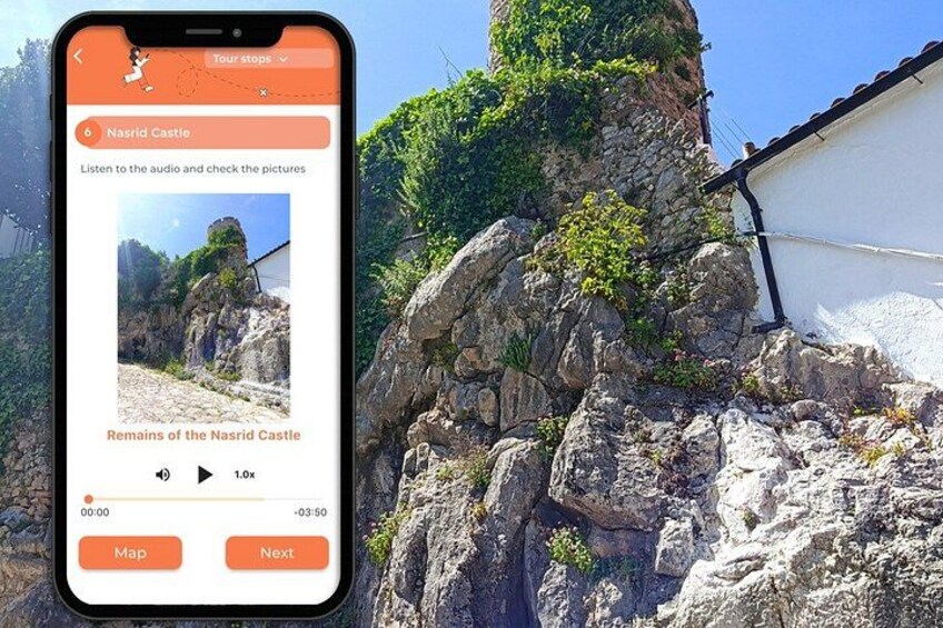 A smartphone displaying a tour stop for the Nasrid Castle with a view of rocky terrain and a white building. 2