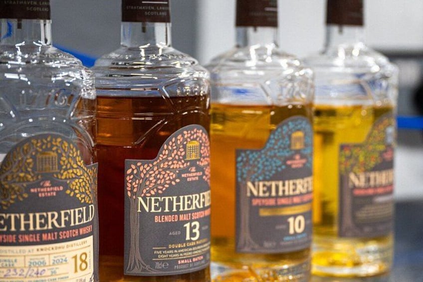 Four bottles of Netherfield whisky with labels indicating different ages. 3