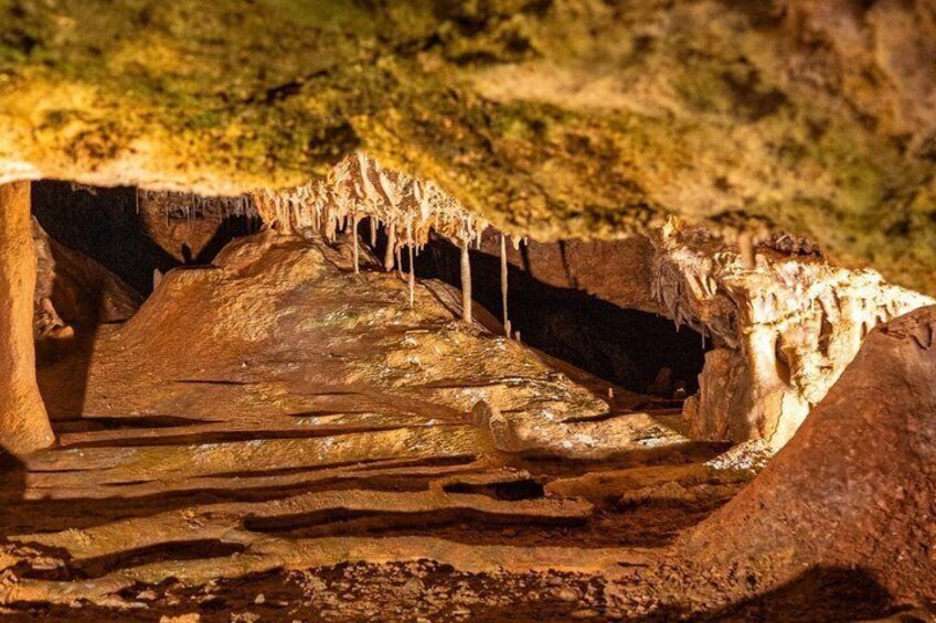 A cave with stalactites and stalagmites. 3