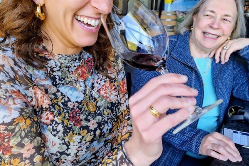 A person holding a wine glass. 2