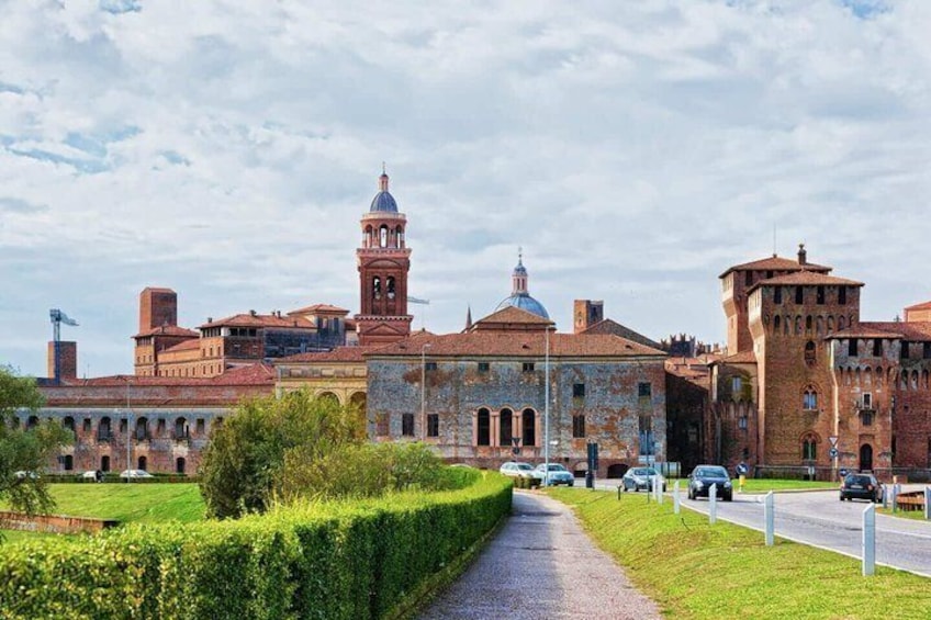A historic building with a bell tower, arched windows, and a dome. 5