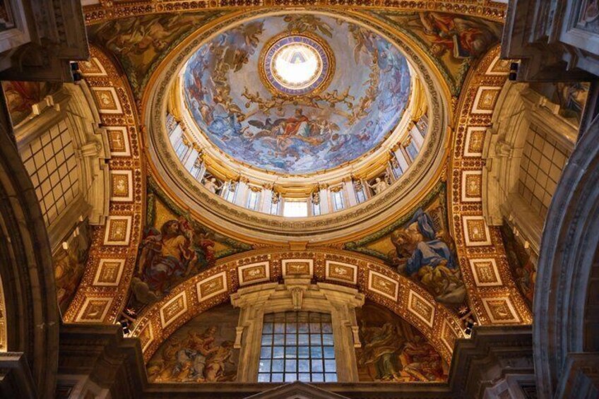 A grand architectural interior with a domed ceiling, ornate frescoes, and classical columns. 3