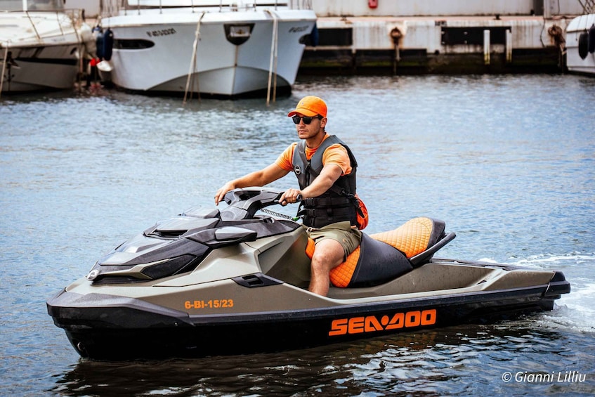 A man on a Sea-Doo jet ski. 4
