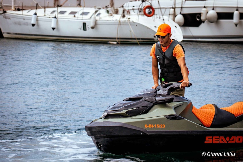 A person on a jet ski with a boat in the background. 5