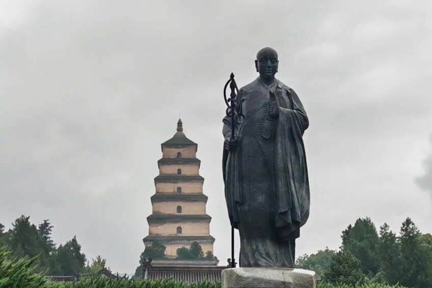 A pagoda and a statue. 5