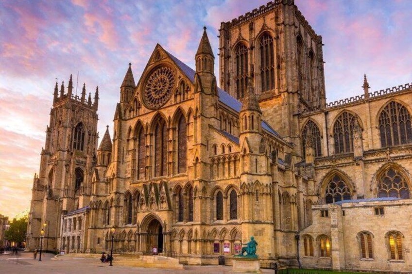 A large Gothic cathedral with intricate architecture, including pointed arches and a large rose window. 4