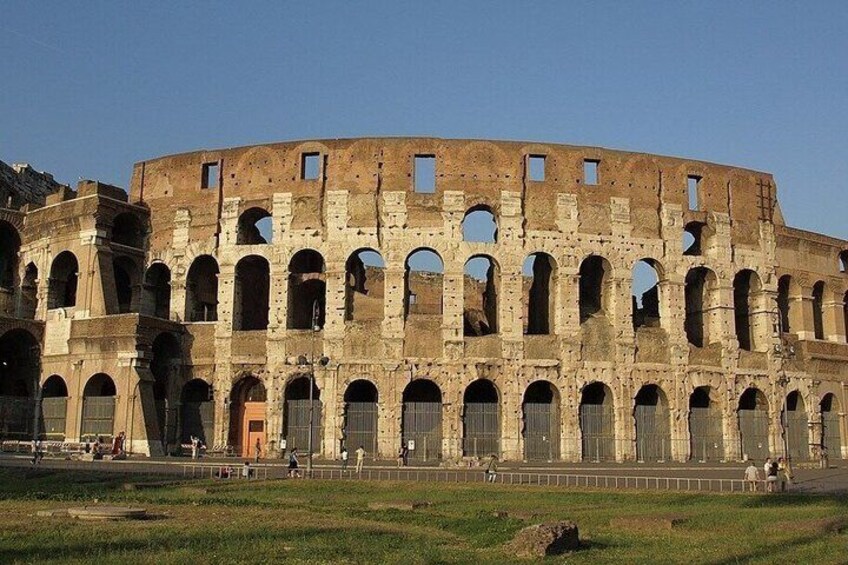 The Colosseum with multiple arches and ruins. 2