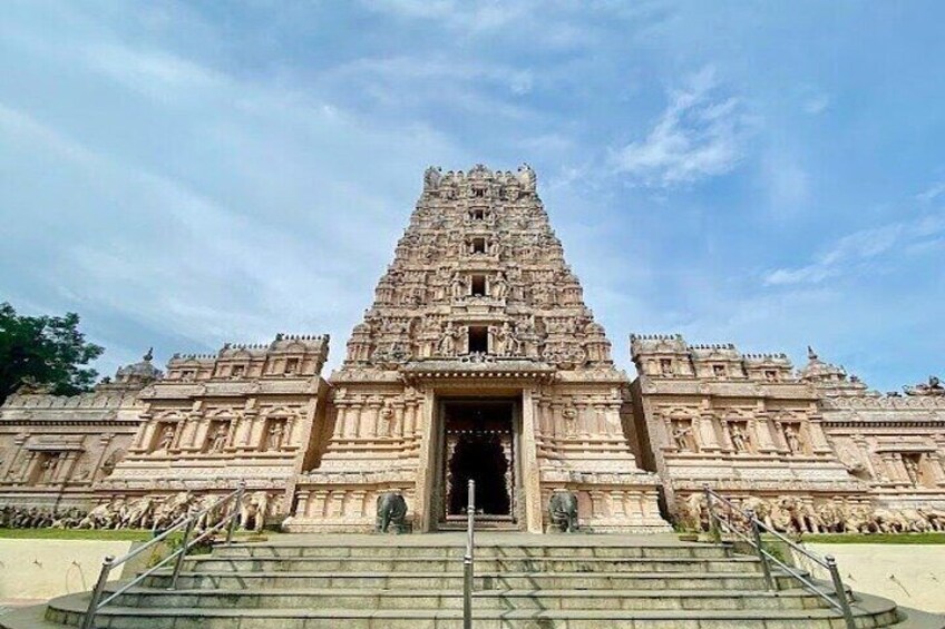A large, ornate temple with a tall, tiered tower and a wide entrance. 3