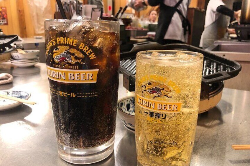 Two glasses of Kirin Beer on a table in a restaurant. 4