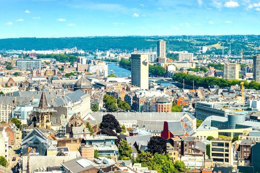 A cityscape with historic buildings, modern skyscrapers, and a river. 4