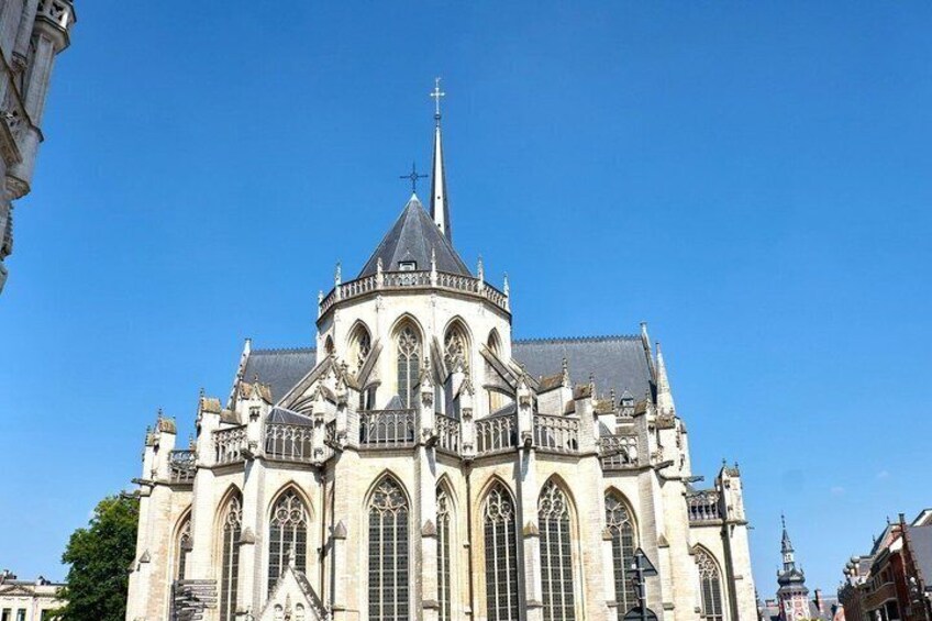 A large, historic cathedral with a prominent spire and intricate architectural details. 3