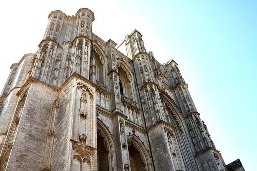 A Gothic cathedral with intricate stonework and pointed arches. 2