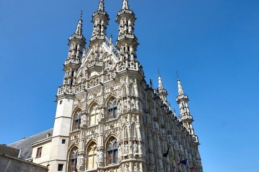 A Gothic-style cathedral with intricate stone carvings and multiple spires. 1