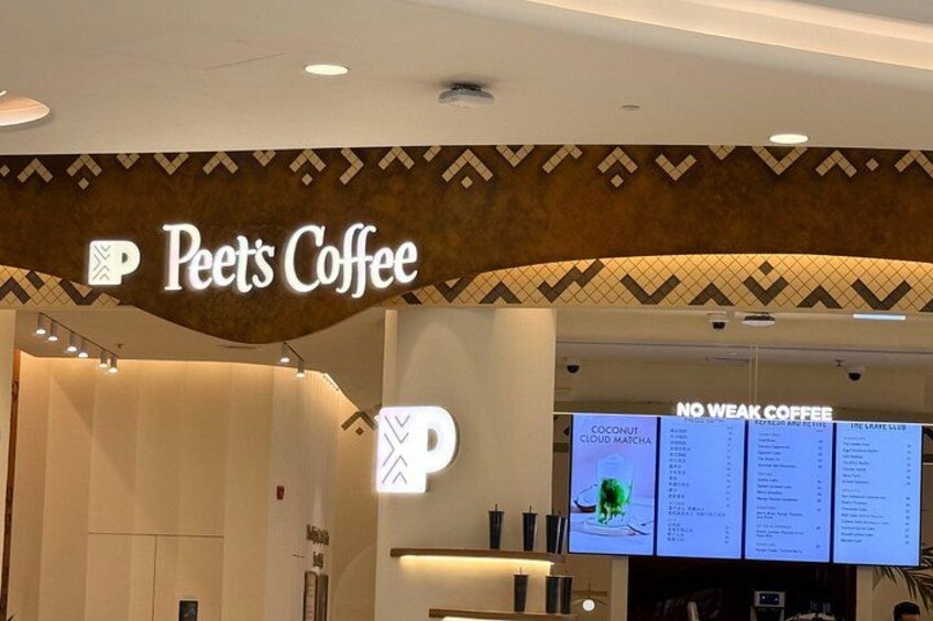 Peet's Coffee sign, a menu board, and a 'No Weak Coffee' sign. 4