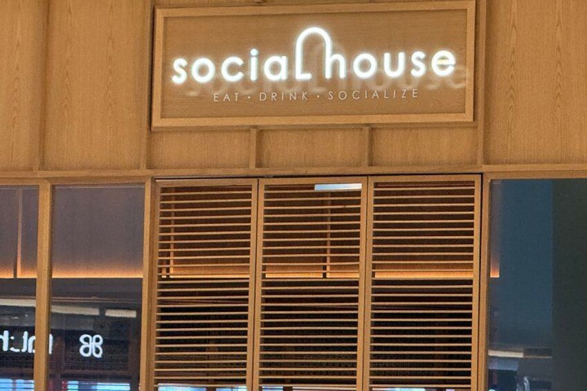 A building with a sign that reads 'socialHouse' and the words 'eat, drink, socialize' below it. 3