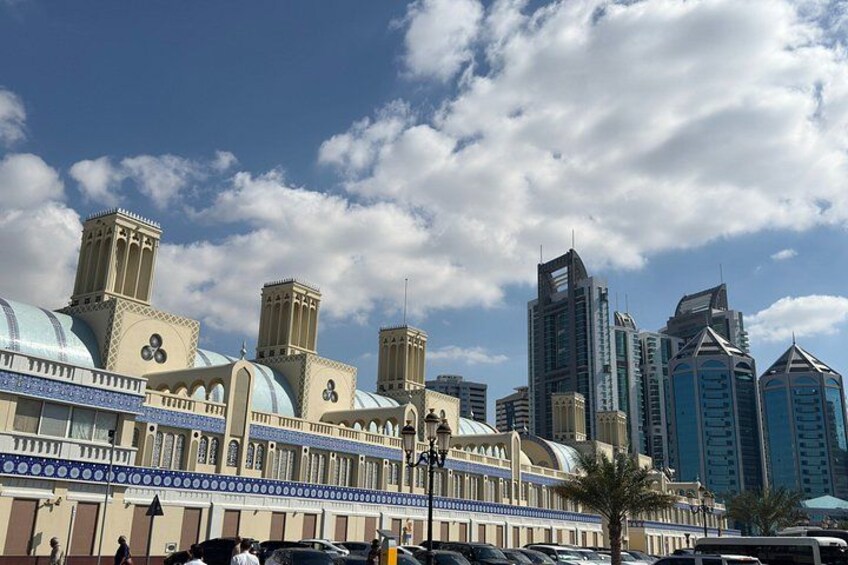 A cityscape with a mix of traditional and modern architecture, including domed buildings and skyscrapers. 3