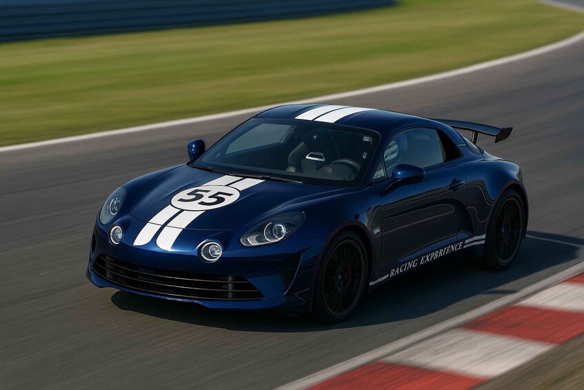 A blue sports car with racing stripes and the number 55 on the hood, driving on a race track. 4