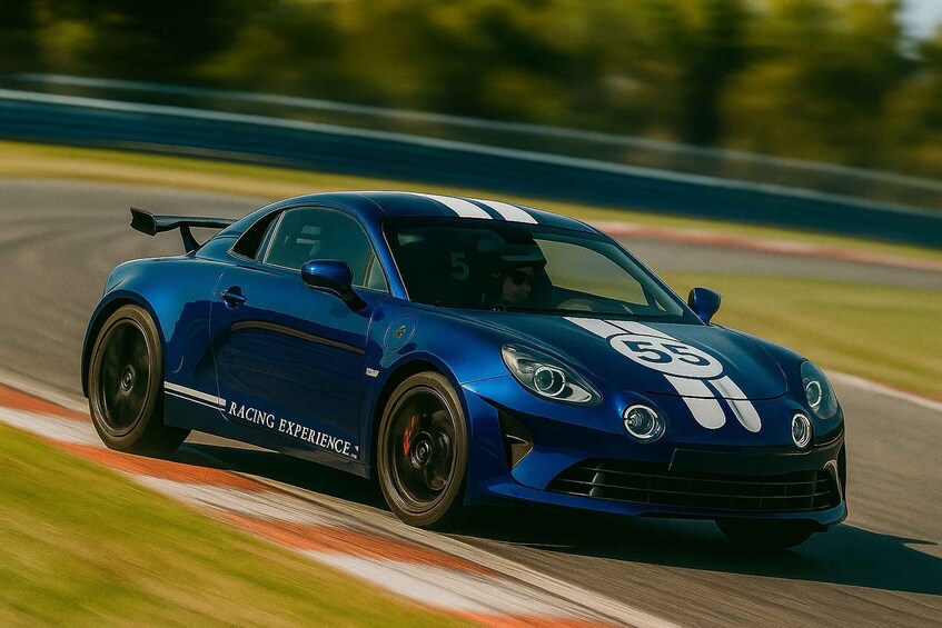 A blue sports car with racing stripes on a race track. 1