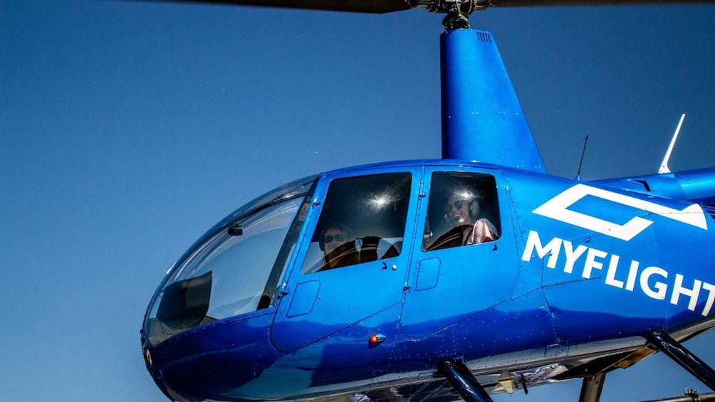 A blue helicopter with 'MYFLIGHT' written on its side. 1