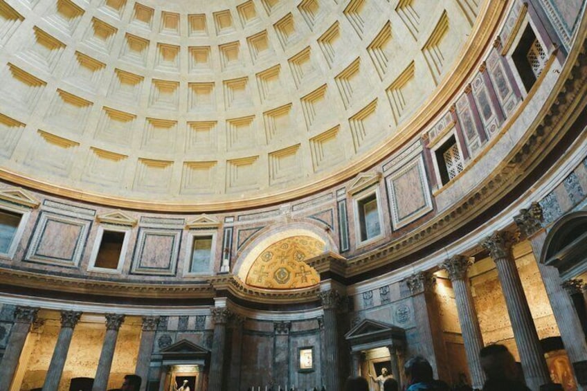 A grand interior with a domed ceiling, ornate columns, and a central decorative element. 5