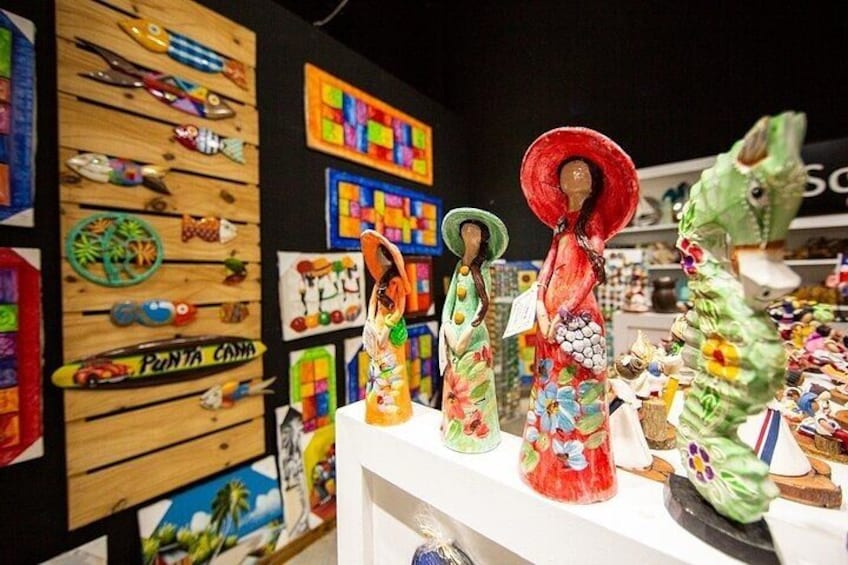 A display of colorful wooden carvings and sculptures. 5