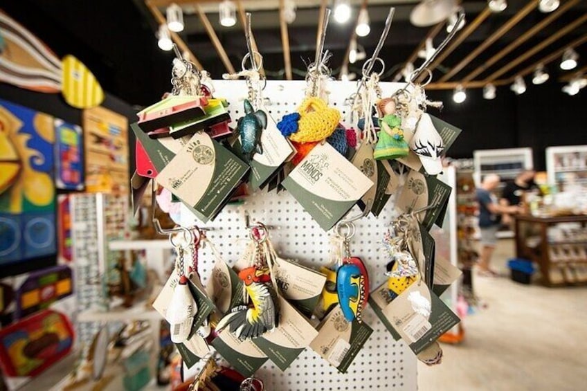 A display of keychains hanging on a pegboard in a store. 4