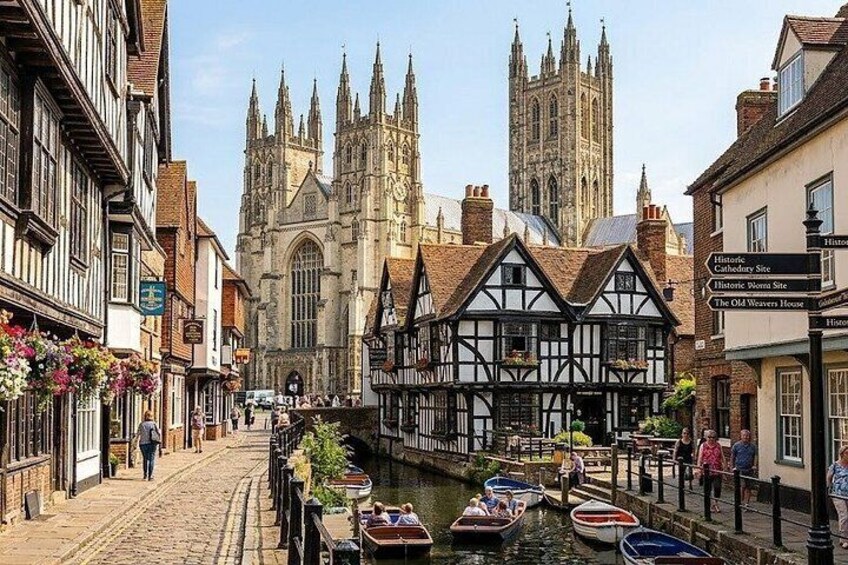 A narrow waterway with boats, historic buildings, and a cathedral in the background. 3