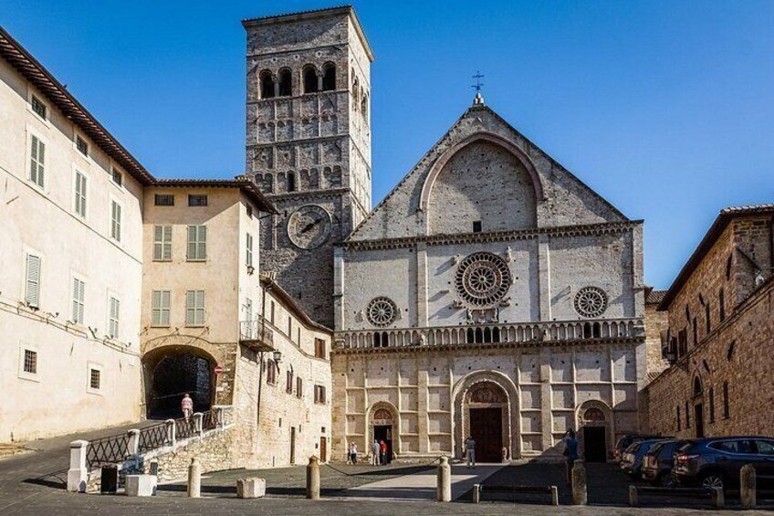 A historic church with a bell tower, arched windows, and a central dome. 3