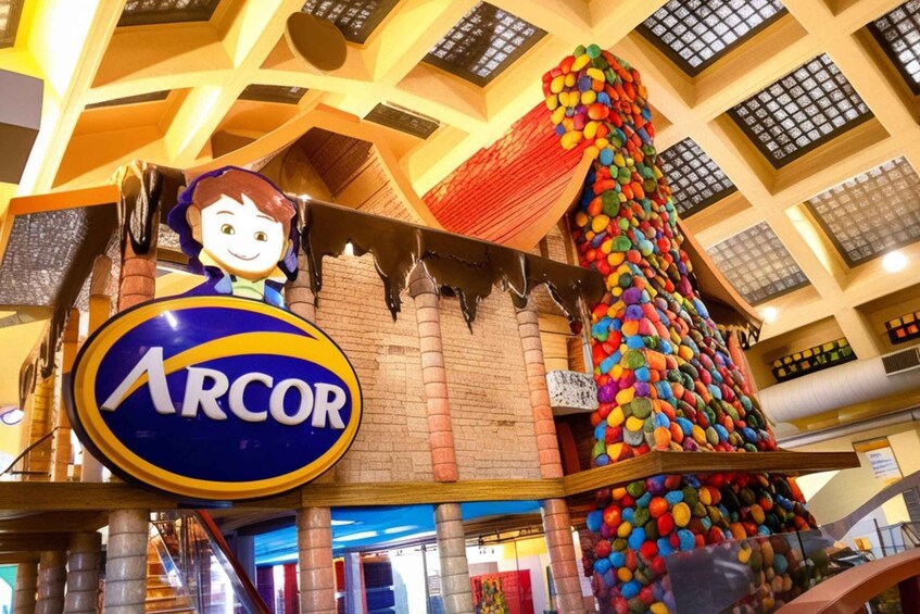 A colorful indoor structure with a sign reading 'ARCOR' and a cartoon character. 1