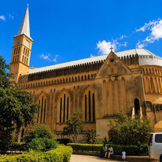 A historic church with a clock tower, arched windows, and a dome. 3