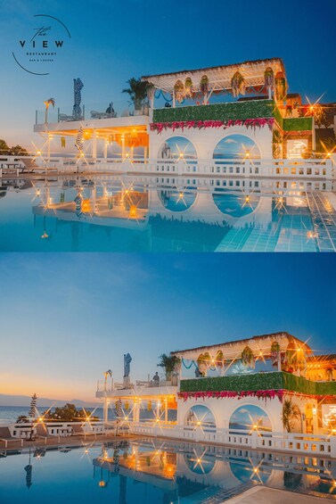 A waterfront restaurant with a pool, outdoor seating, and decorative lighting. 5