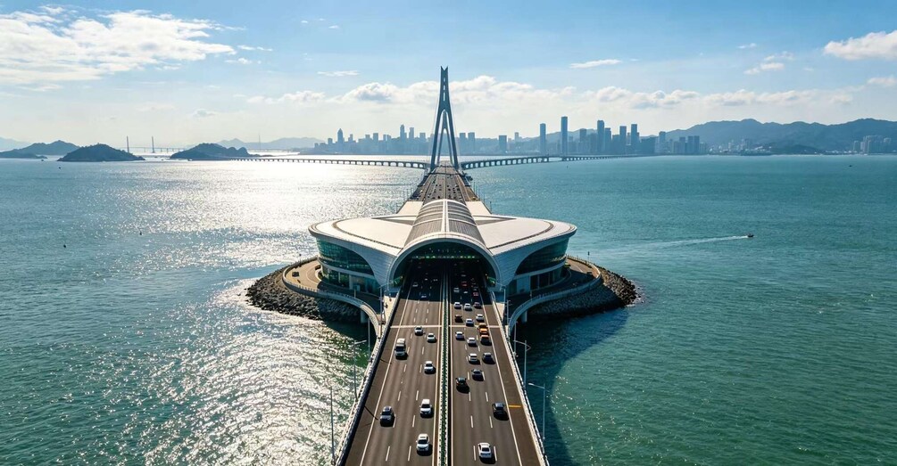 A bridge with a unique arch design, a city skyline in the background, and a body of water in the foreground. 1