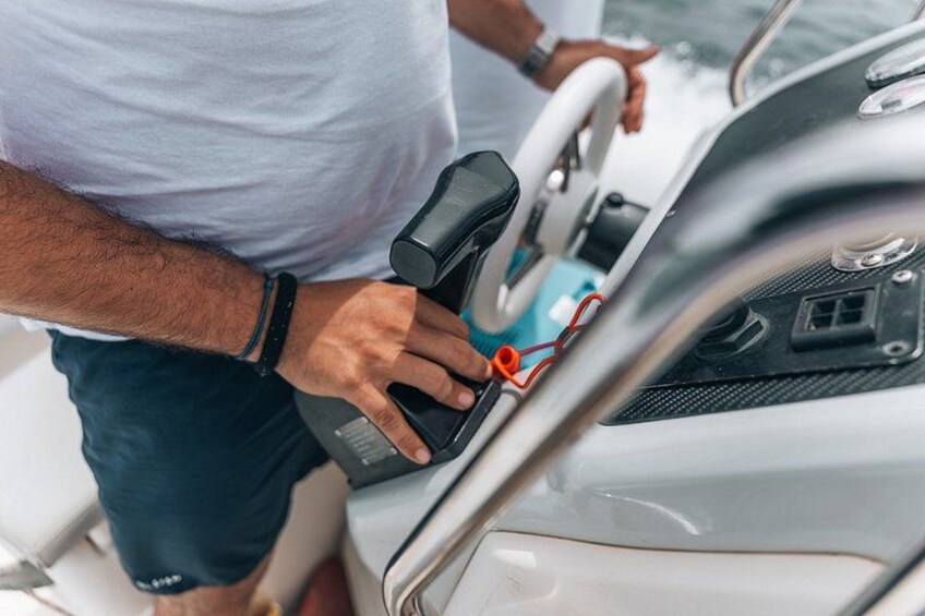 A person handling a device near a vehicle's interior. 3