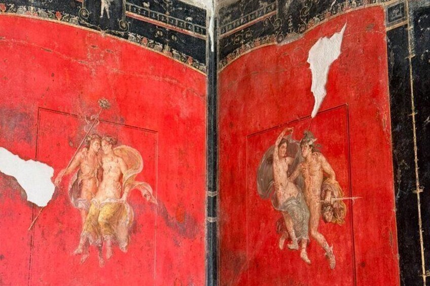 A red and black fresco with classical figures, some of which are damaged. 4