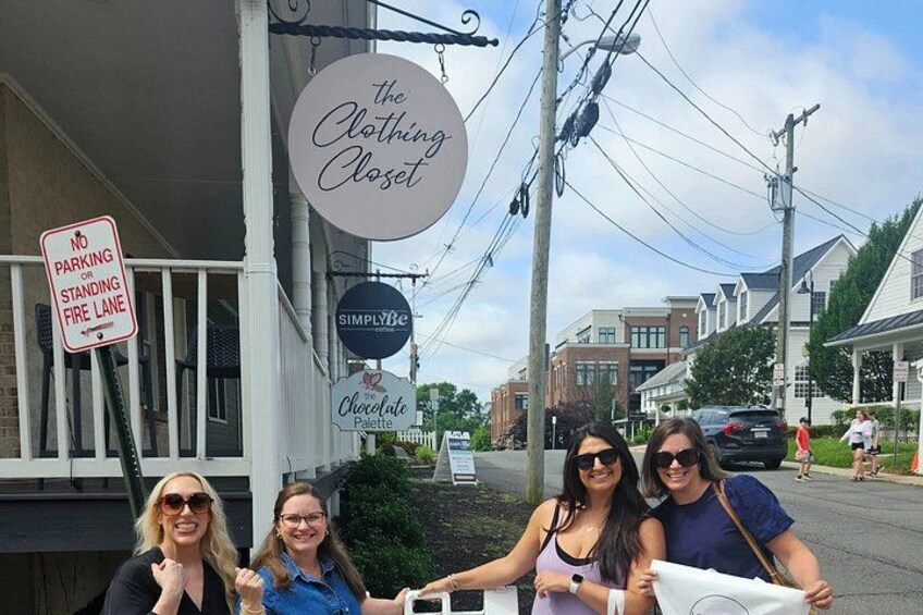 A storefront with signs for 'The Clothing Closet' and 'Simply Be.' 4