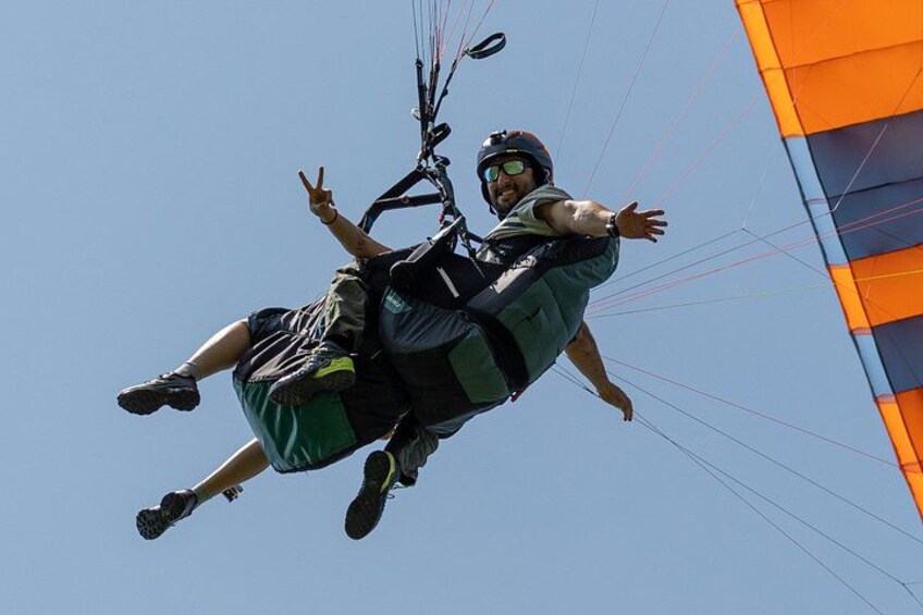 A person paragliding with a parachute. 1