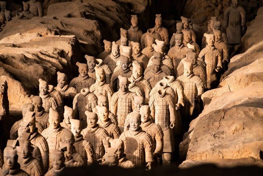 A terracotta army of soldiers in a cave. 5