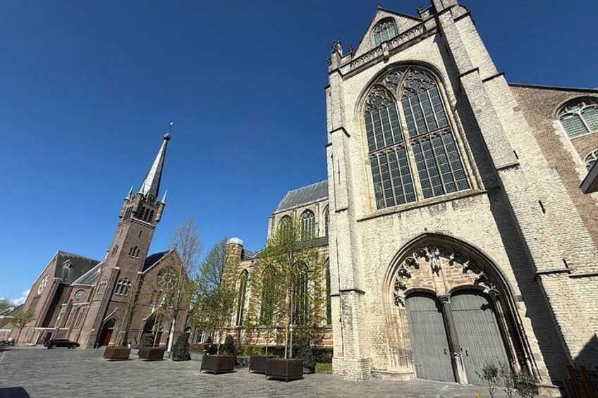 A historic church with a tall spire and large stained glass windows. 5